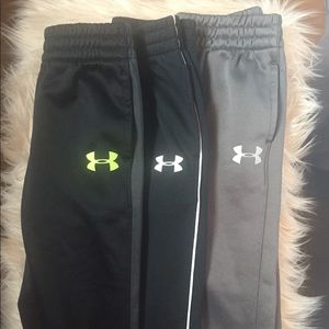 Three pairs of under armour boys pants